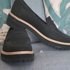 Toms Black Penny Loafers with Tan Welt